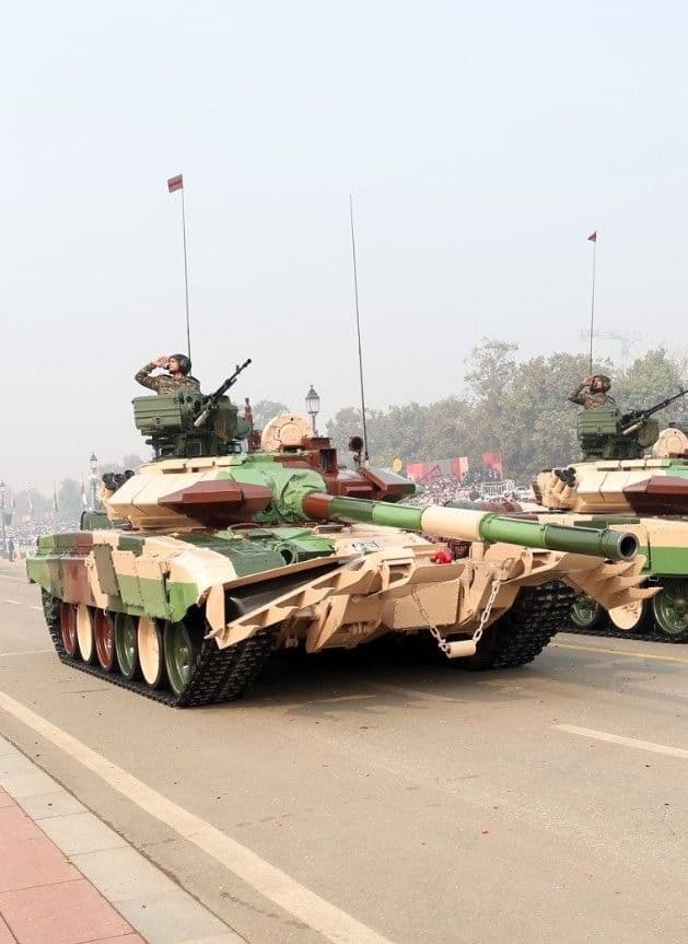 Indian Army tanks on parade, crews saluting