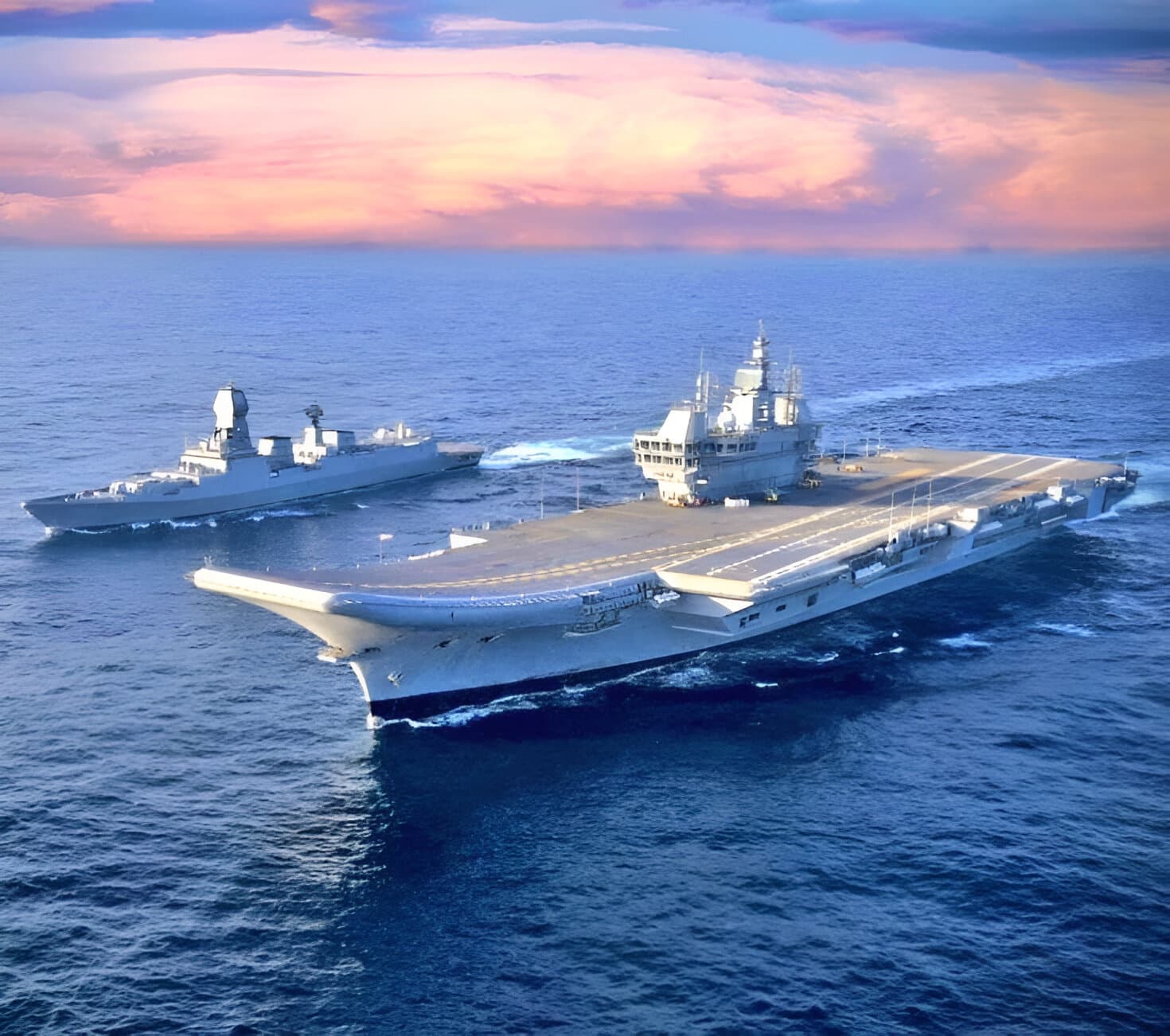 Indian Navy aircraft carrier and destroyer at sea at dusk